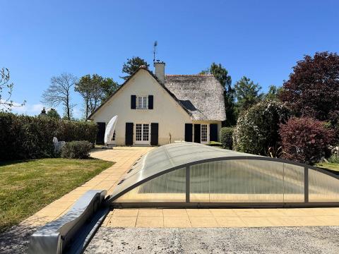 Timeless charm and unspoiled nature define this exceptional thatched cottage in Trégomeur.