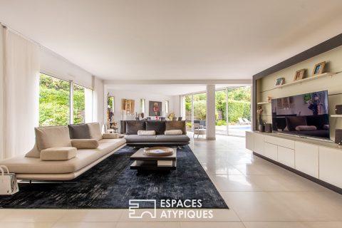 Single-story architect-designed house with swimming pool and outbuildings