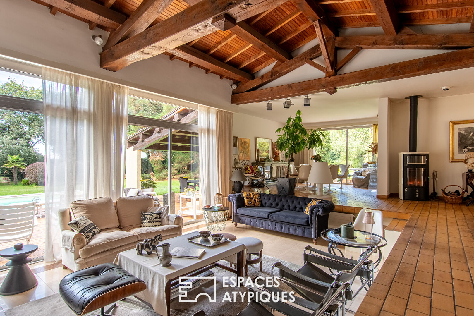 Single-story property with swimming pool in landscaped grounds