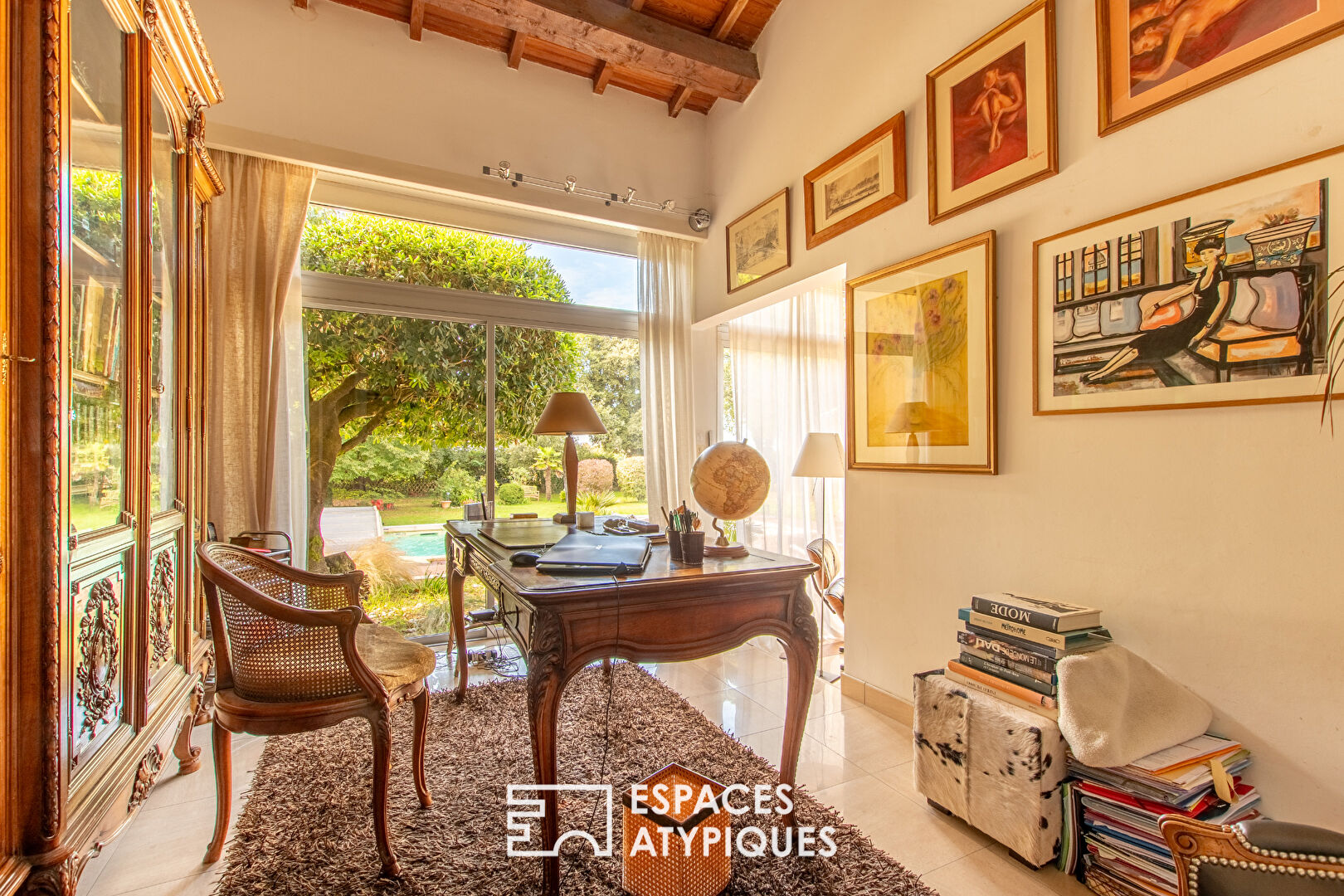 Single-story property with swimming pool in landscaped grounds