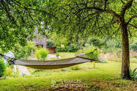 Maison à ossature bois dans un écrin de verdure