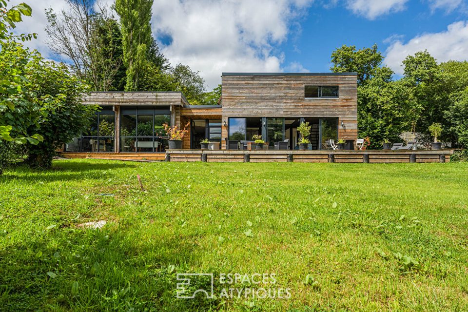 Maison d'Architecte ossature bois dans un écrin verdoyant