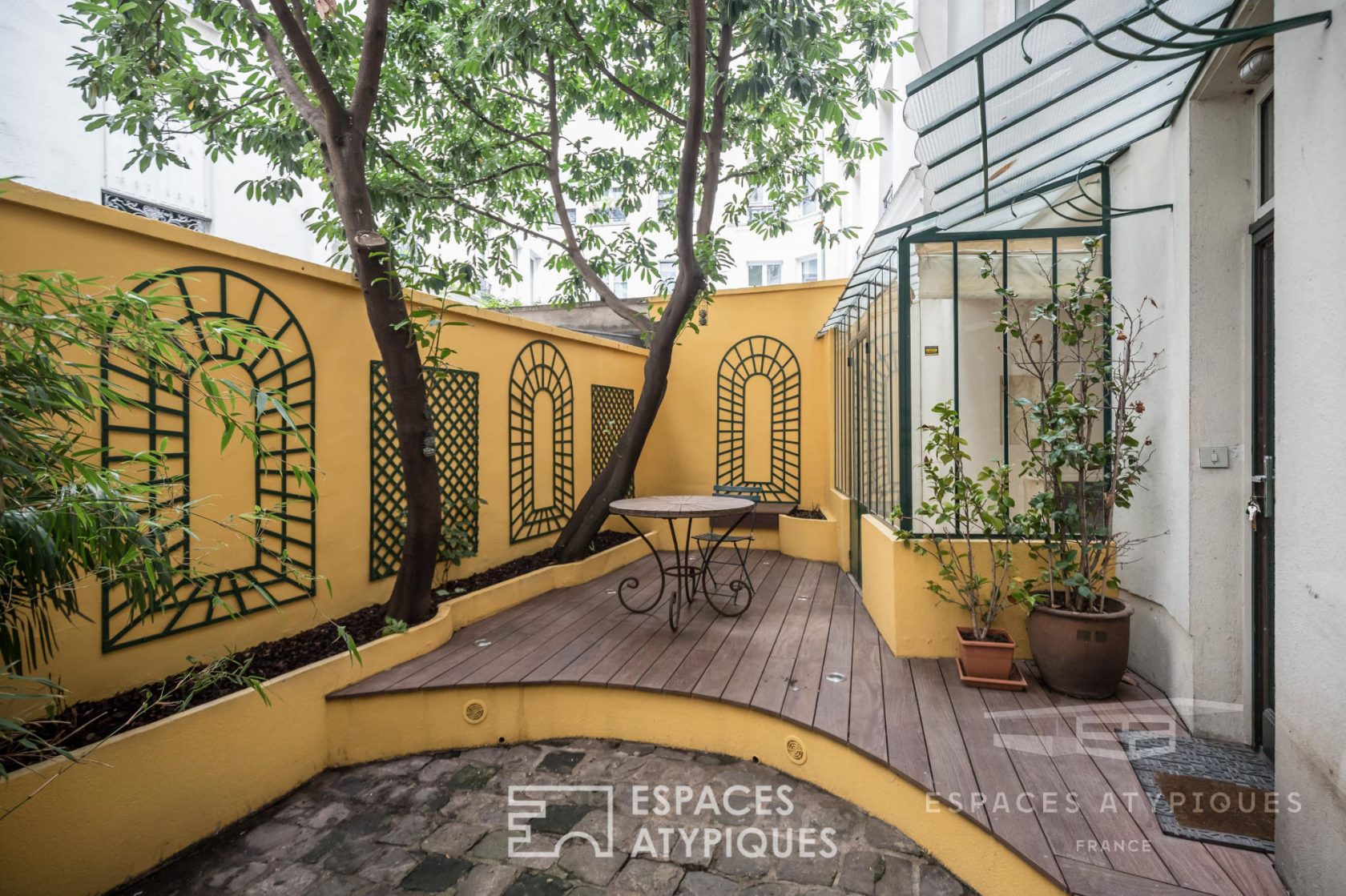 Duplex with glass roof and private courtyard with trees