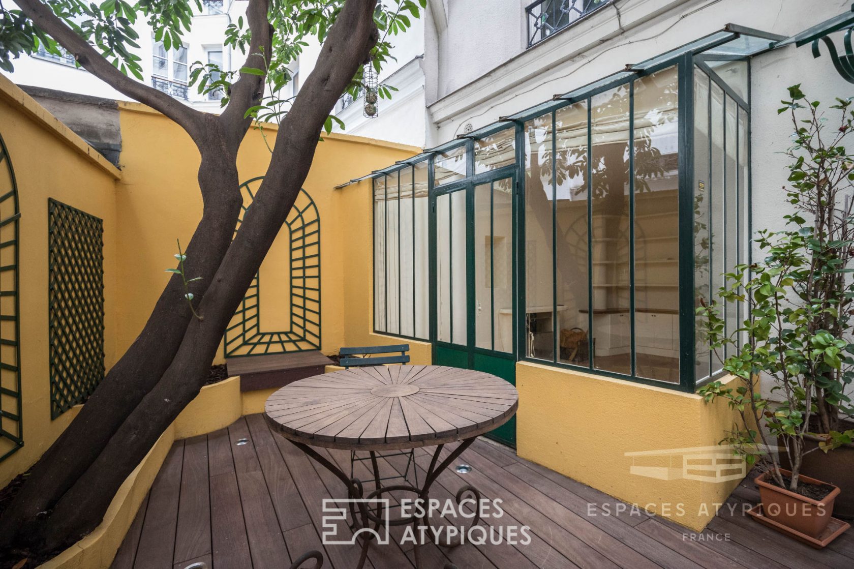 Duplex with glass roof and private courtyard with trees