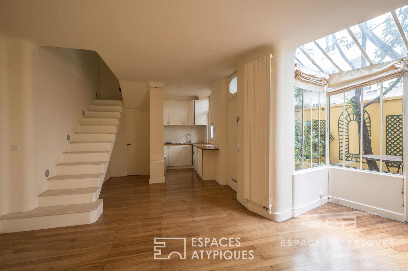 Duplex with glass roof and private courtyard with trees