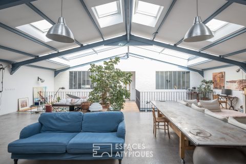 Former sawmill rehabilitated in loft with terrace