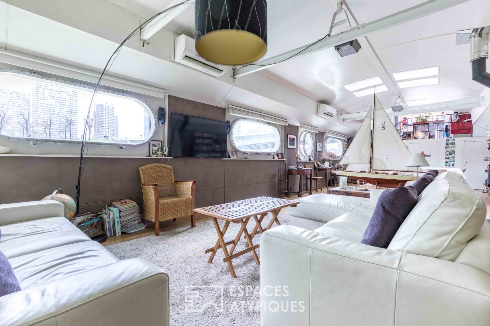 Barge with terrace and Eiffel Tower view