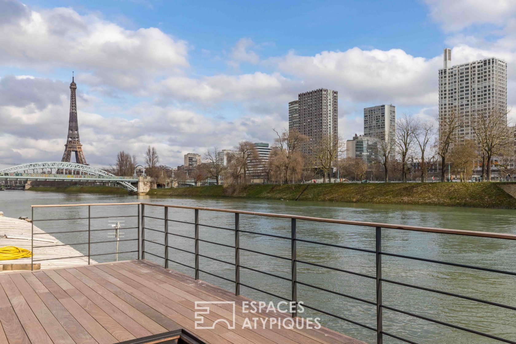 Barge with terrace and Eiffel Tower view