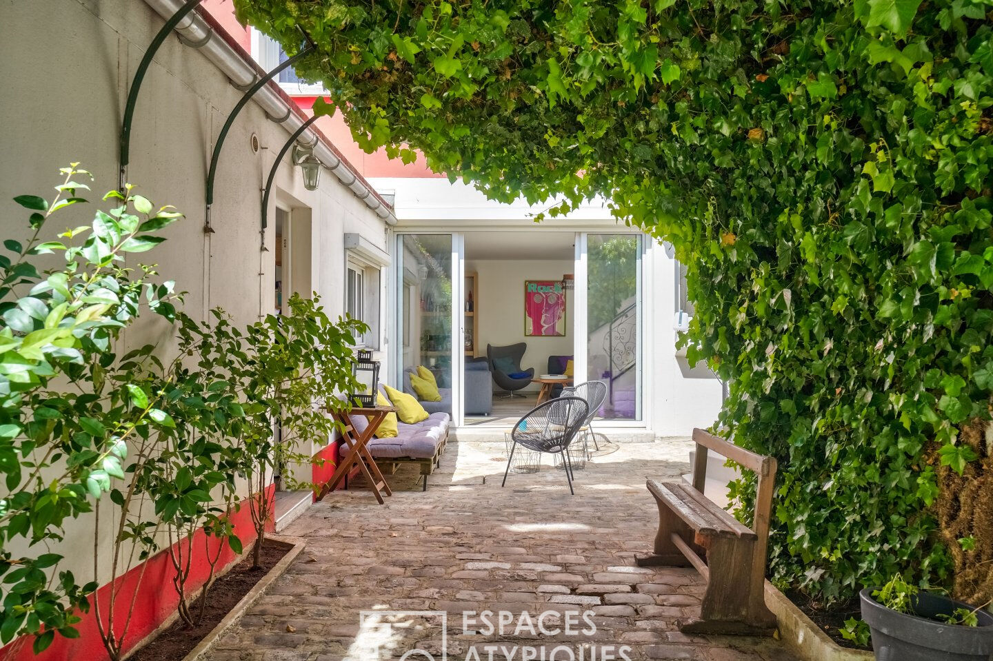 House with green courtyard and terraces