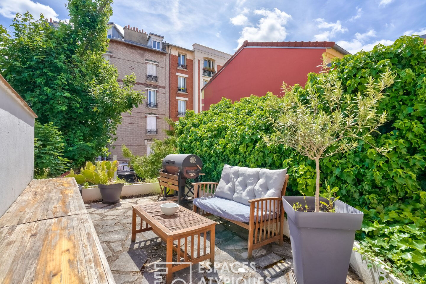 House with green courtyard and terraces