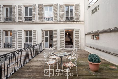 Appartement et ancien atelier de photographe avec terrasse à repenser