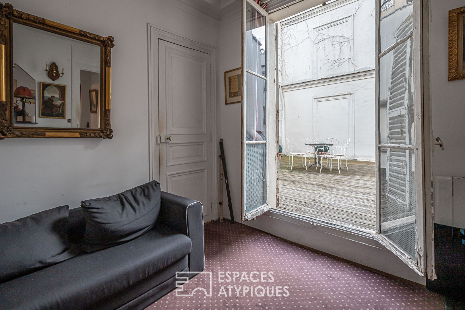 Appartement et ancien atelier de photographe avec terrasse à repenser