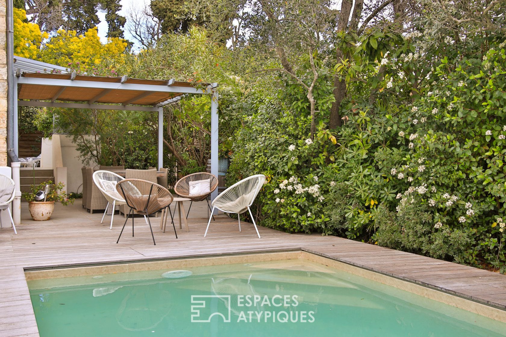 “Art Deco” house in a bubble of greenery with landscaped garden and swimming pool