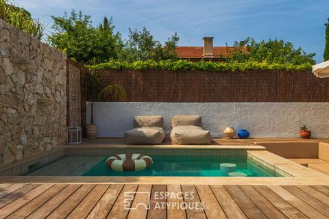Contemporary renovation with landscaped exterior and swimming pool