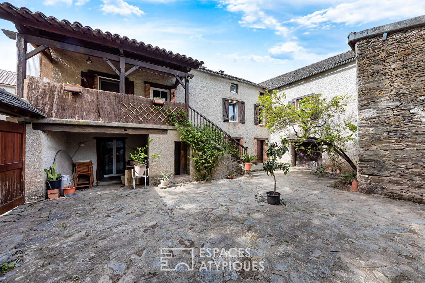 Old renovated farmhouse with outbuildings