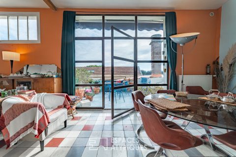 Apartment rehabilitated in a former factory and its artist’s studio