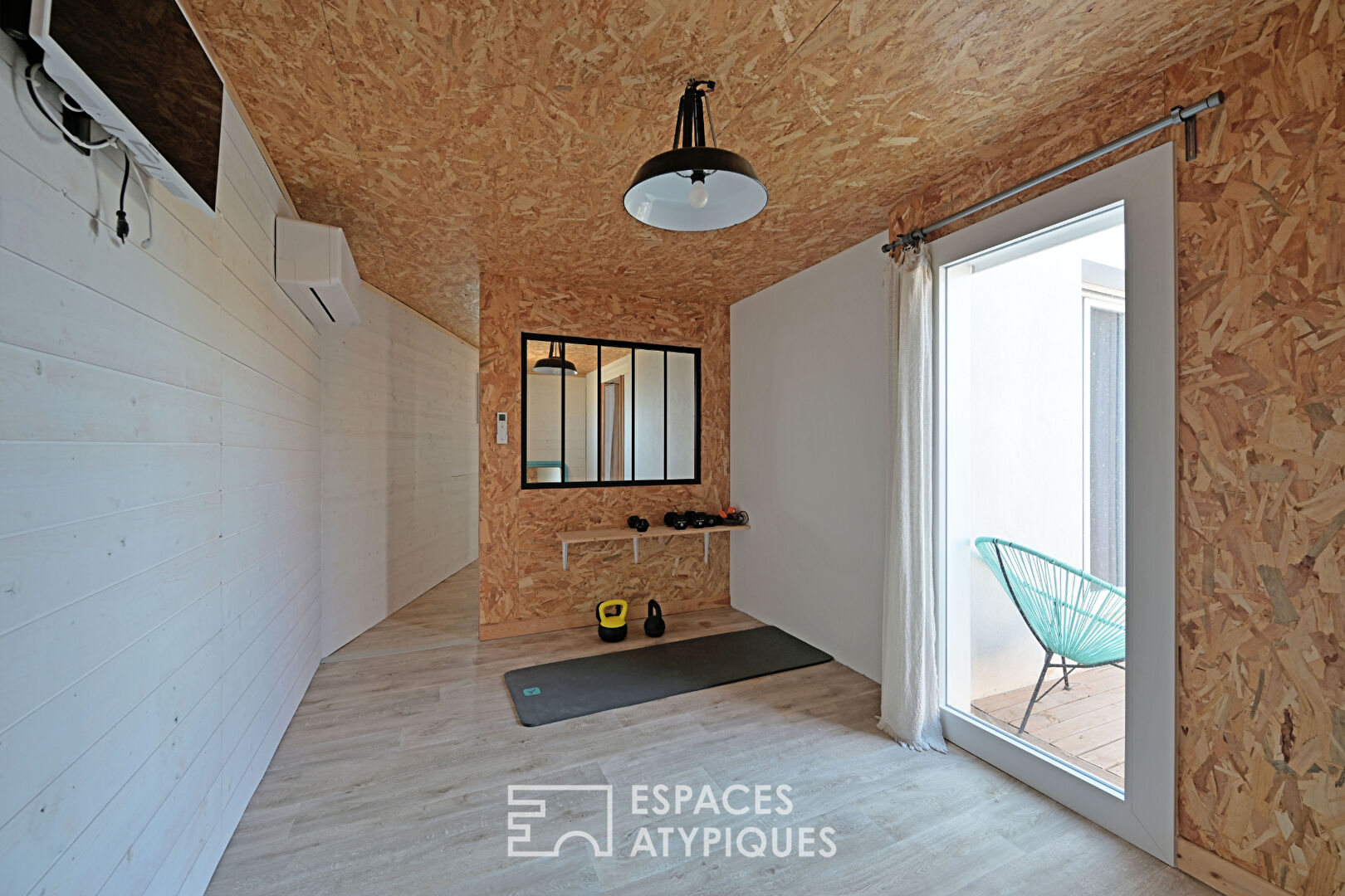 Contemporary house and its wooden extension