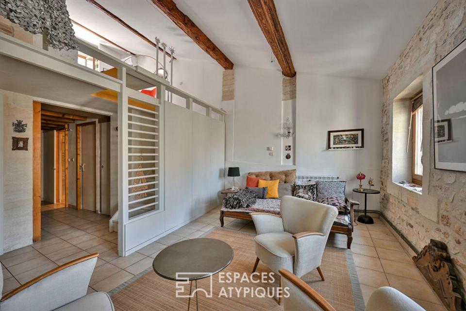 Appartement de type loft avec terrasse sur les toits