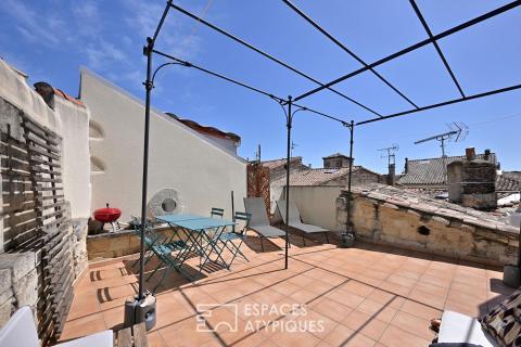 Appartement de type loft avec terrasse sur les toits