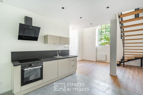 Appartement rénové dans un immeuble en pierres