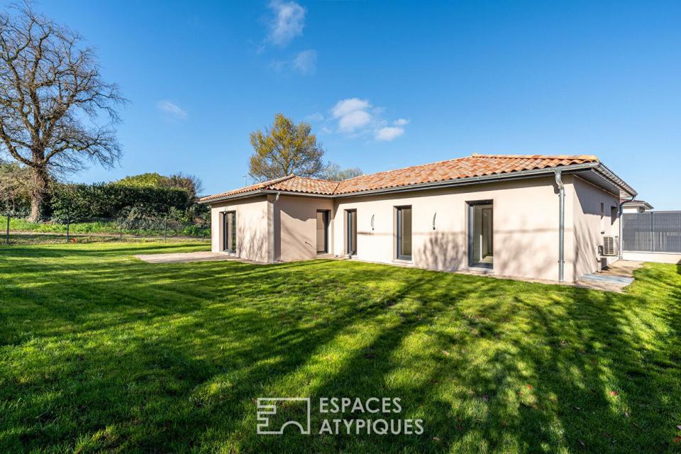 Maison neuve avec jardin et garage