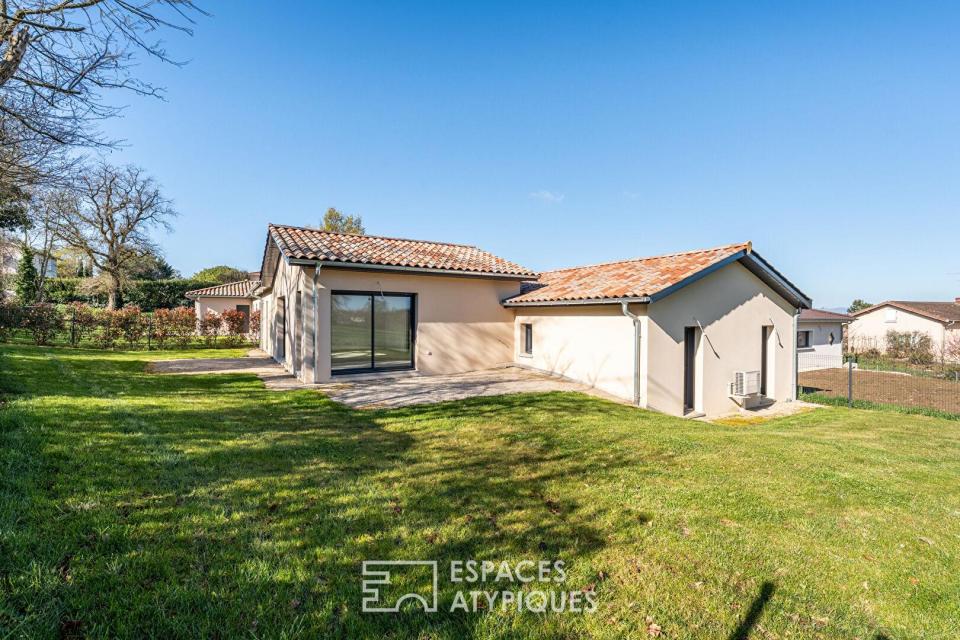 Maison neuve avec jardin et garage