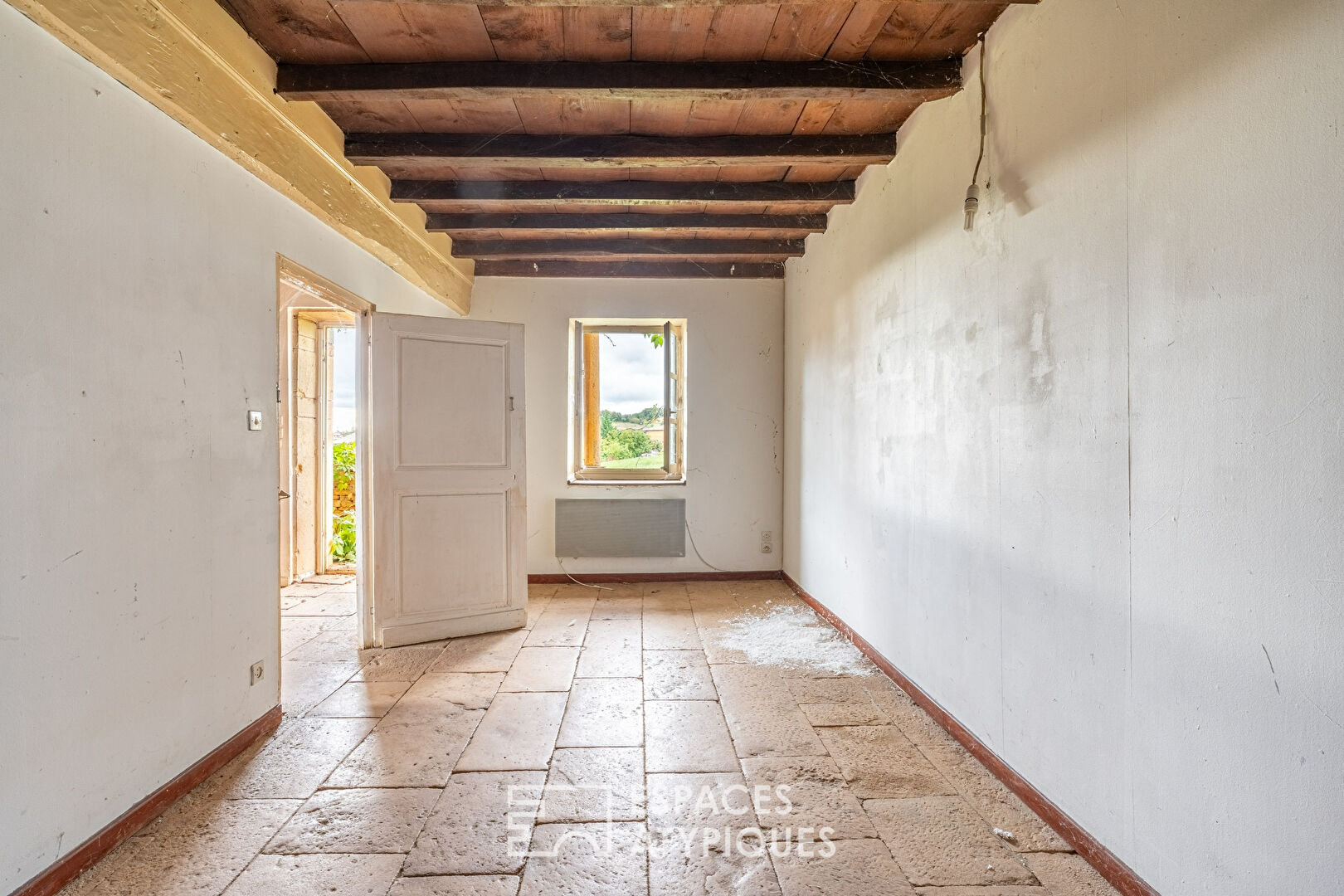 Golden stone house with great potential