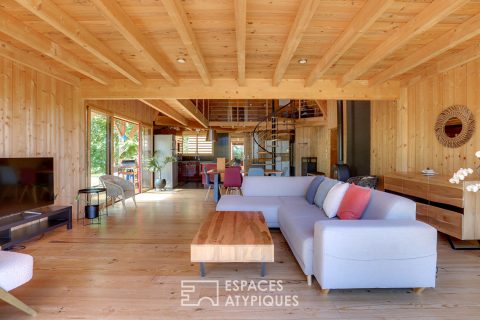 The elegant wooden house in its green setting