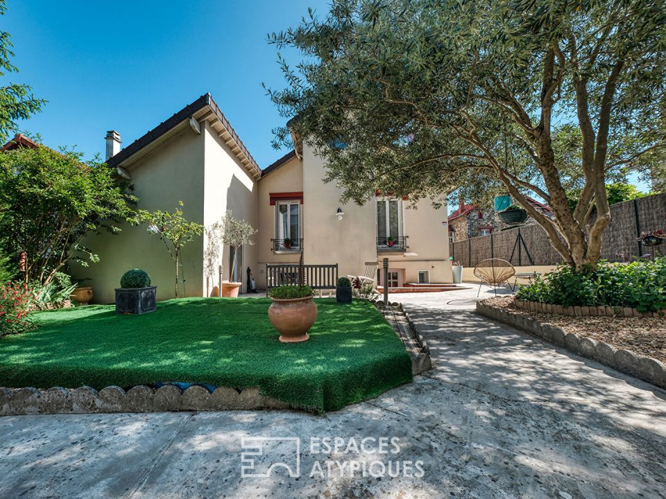 Maison de charme avec studio indépendant et jardin.
