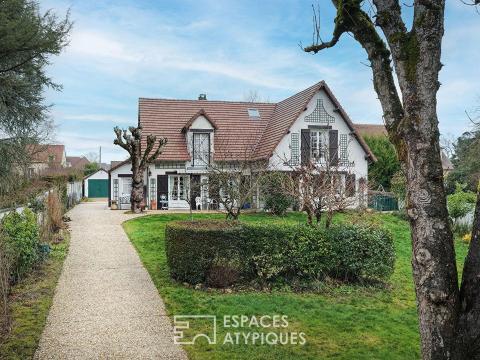 Maison années 70 avec une dépendance sur un parc arboré