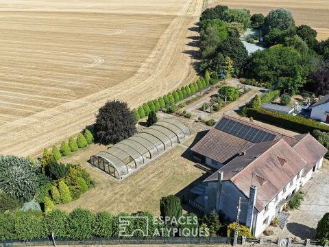 Propriété familiale avec parc paysager, étang, piscine et garage XXL