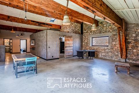 Former wine cellar converted into an industrial loft in Camplong-d’Aude