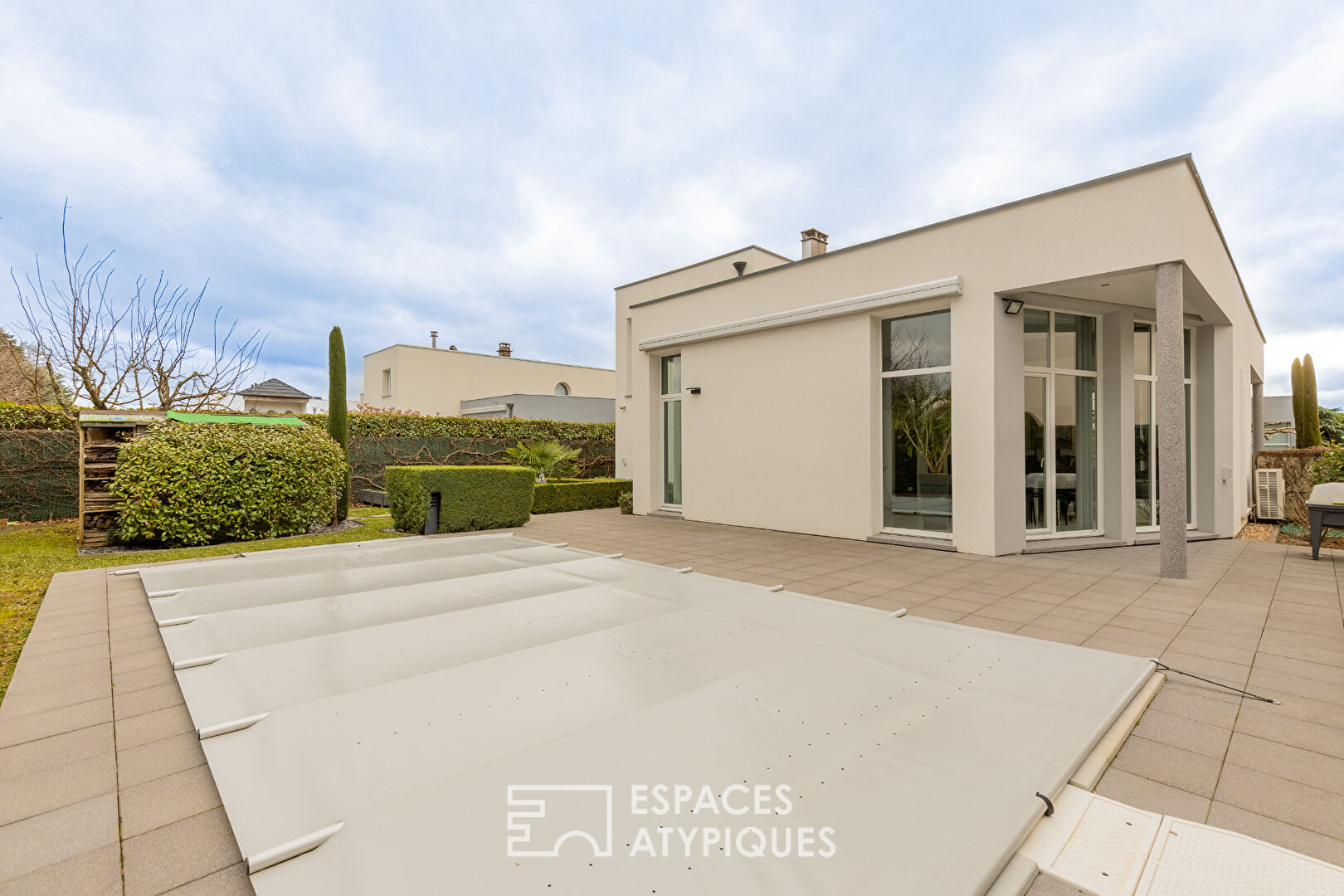 Contemporary house with swimming pool and garden