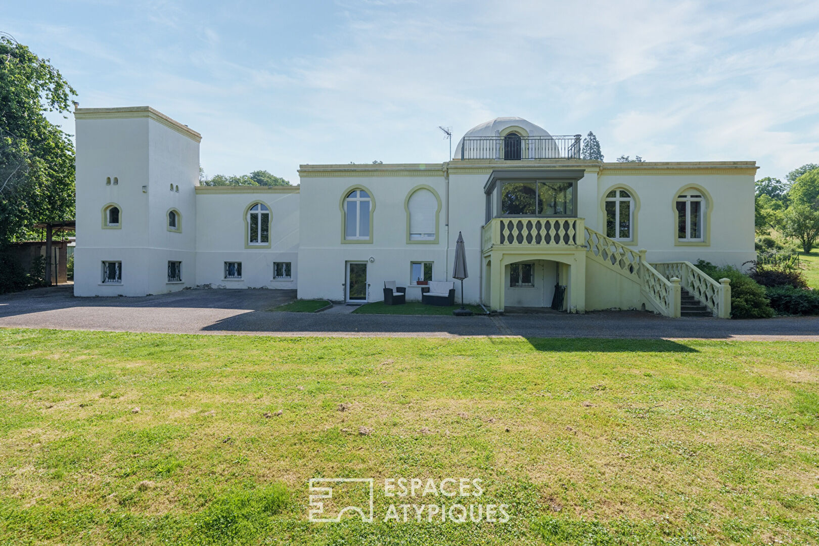 Elegant neo-Moorish residence with wooded park and swimming pool