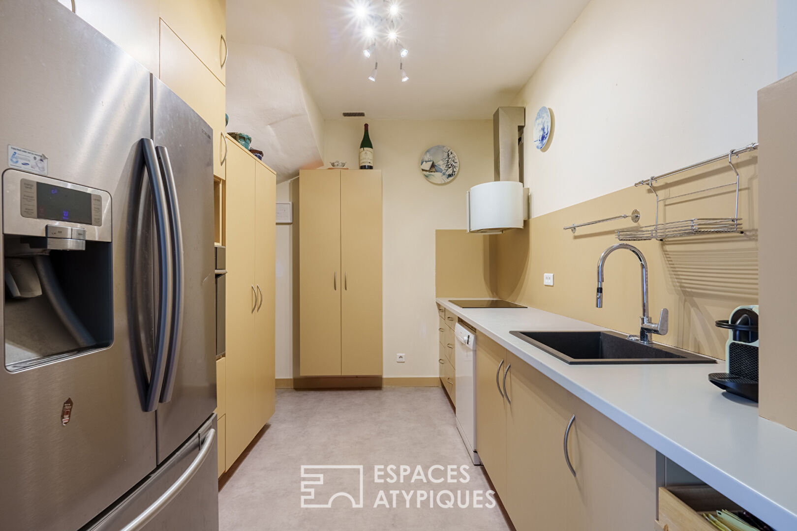 Triplex et son jardin comme une maison en coeur de ville