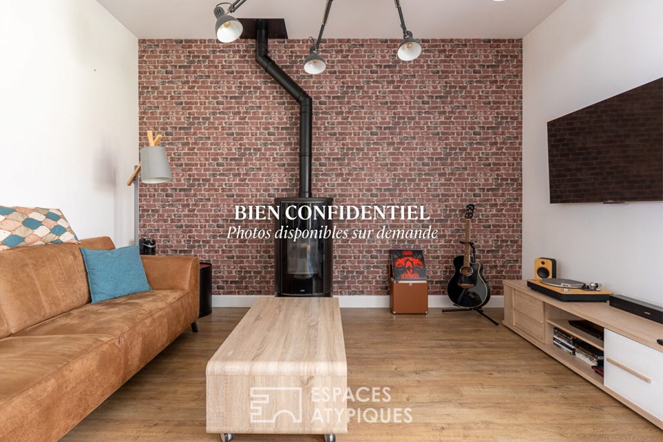 Ancienne épicerie réinventée en lieu de vie contemporain