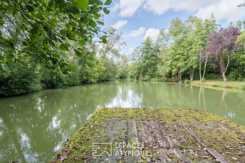 Charming property with pond, rivers, and cottages