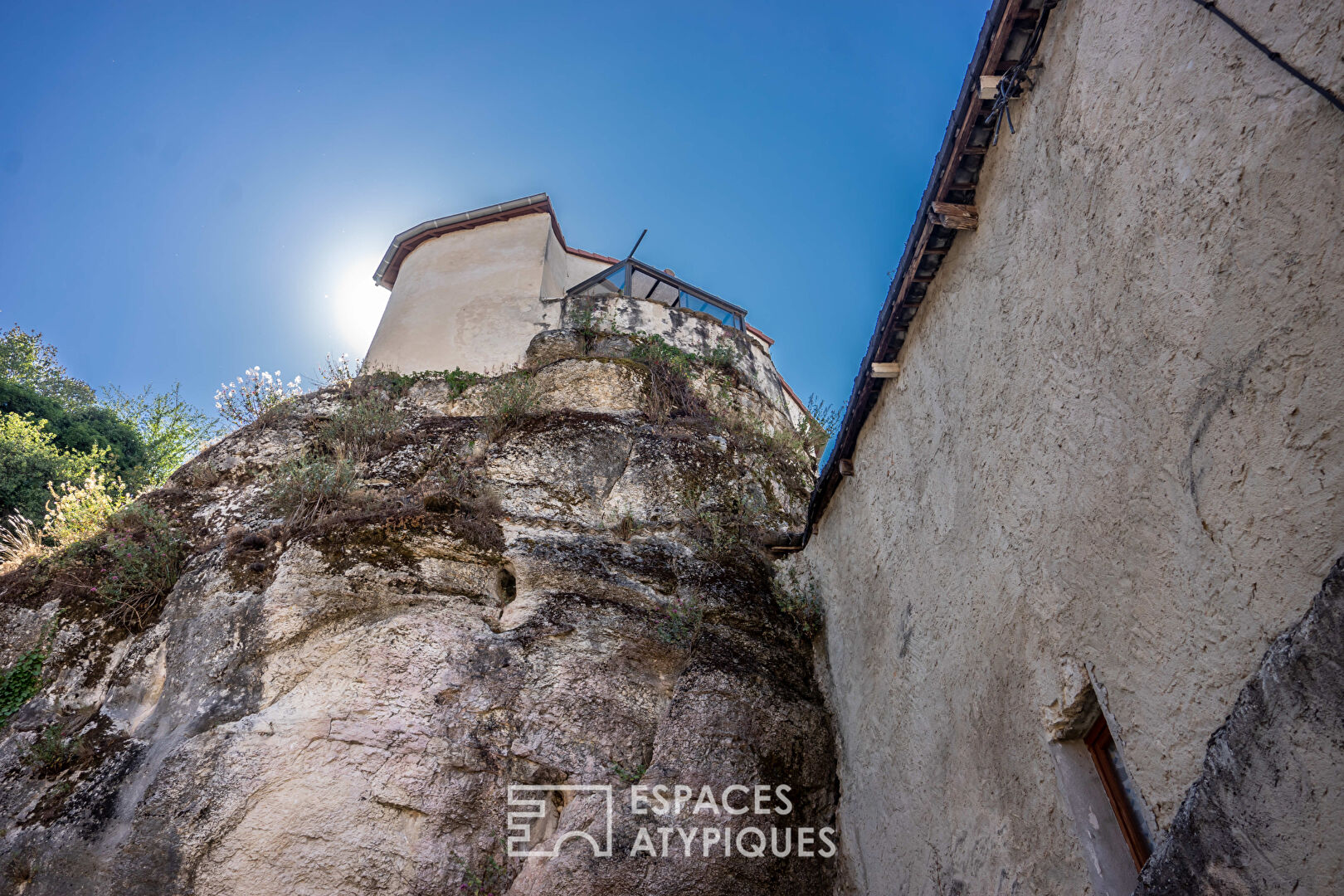 House built on a rock at the foot of the Vercors mountains