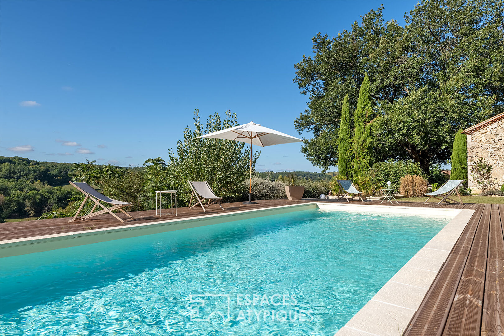 Old renovated sheepfold and its swimming lane overlooking the valley