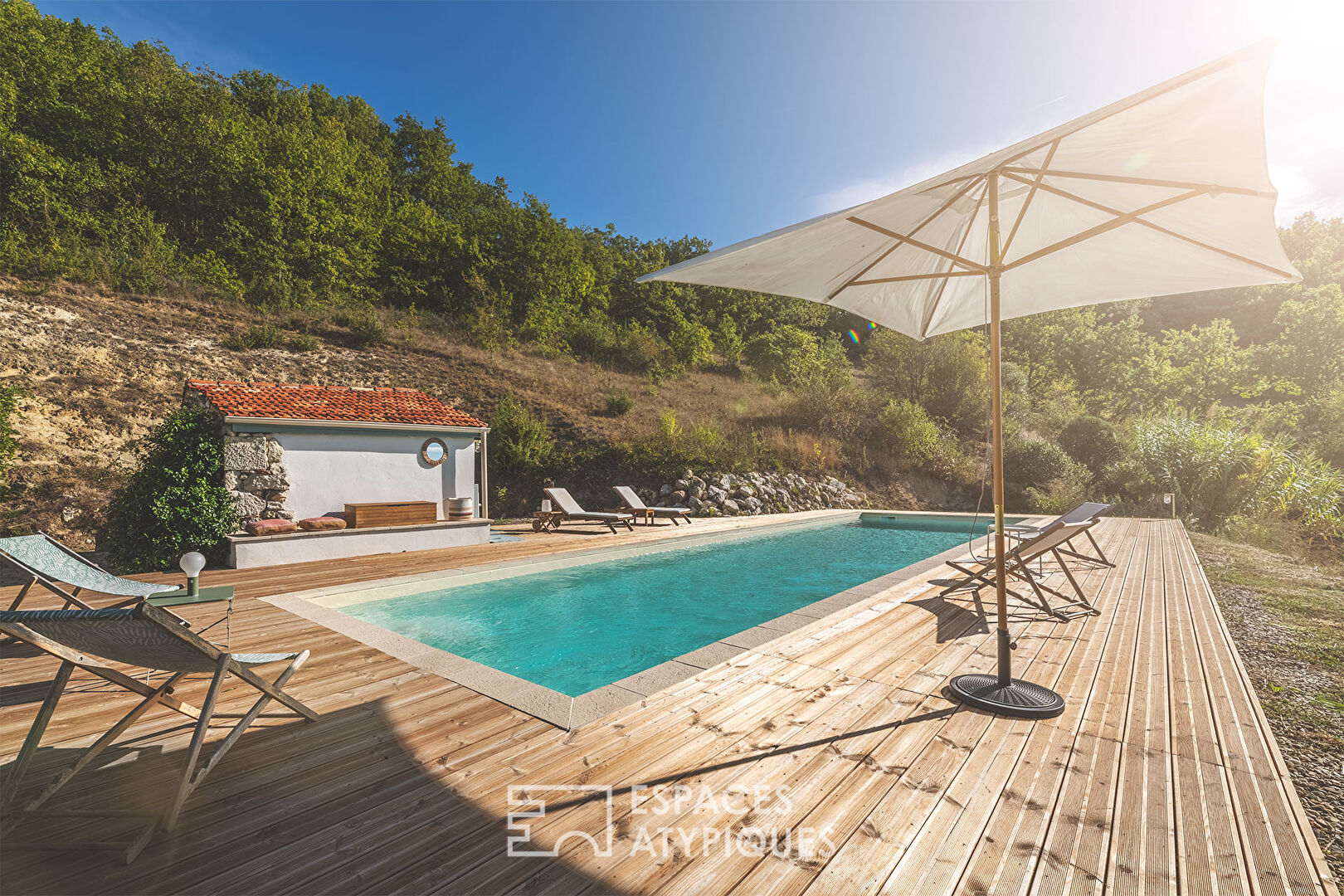 Old renovated sheepfold and its swimming lane overlooking the valley