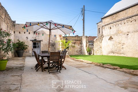 Exceptionnelle maison de négoce de vins en plein coeur de ville