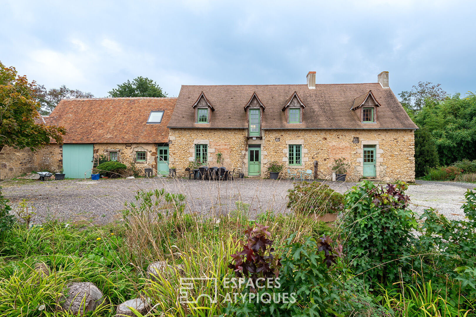 Large property with outbuildings and lake