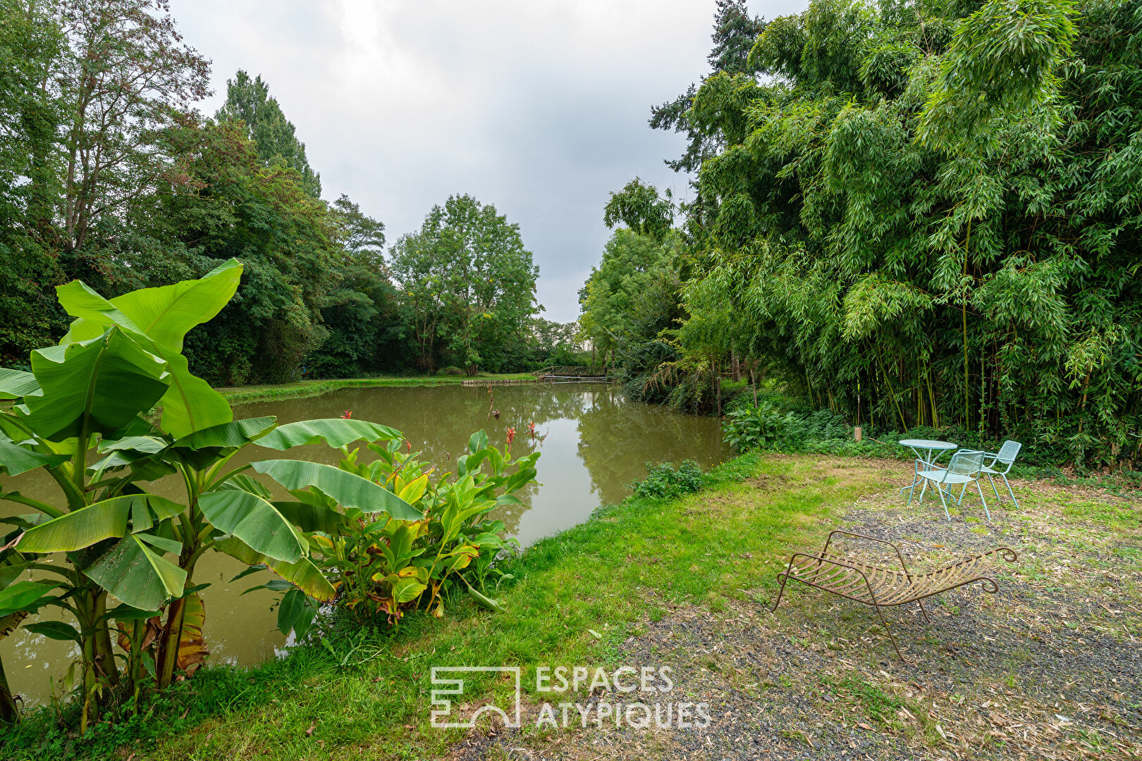 Large property with outbuildings and lake