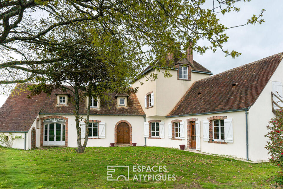Grande maison de campagne à fort potentiel dans un cadre verdoyant