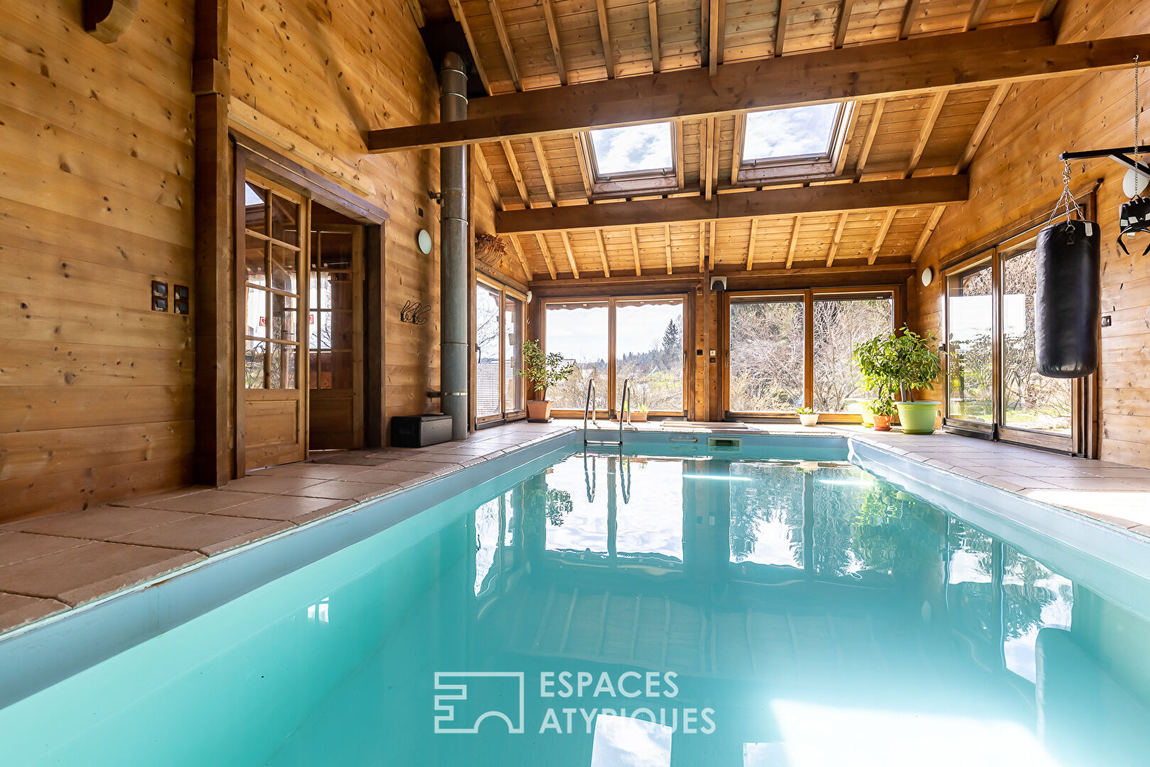 The real log cabin with its indoor swimming pool