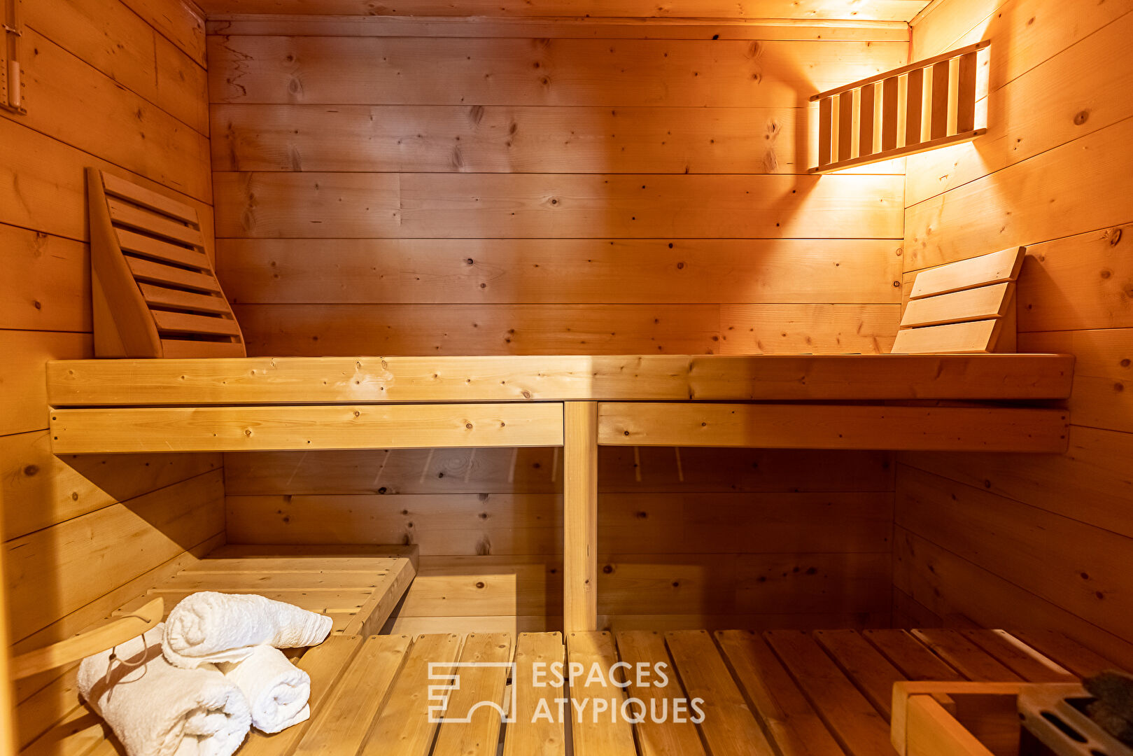 The real log cabin with its indoor swimming pool