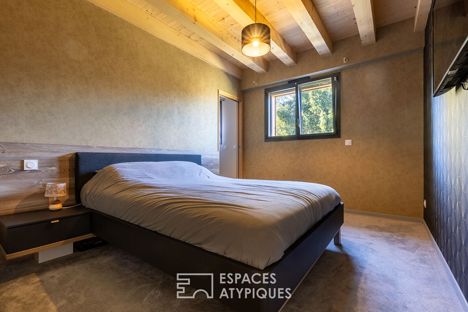 The contemporary chalet close to Switzerland with its unobstructed view and indoor swimming pool