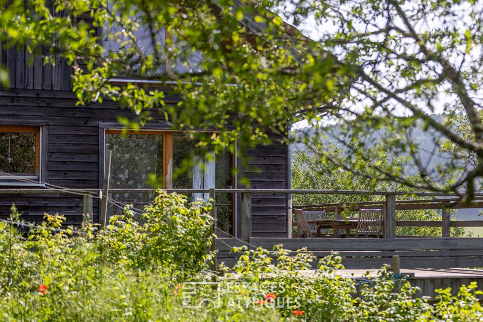 Maison à ossature bois au calme avec son jardin paysagé