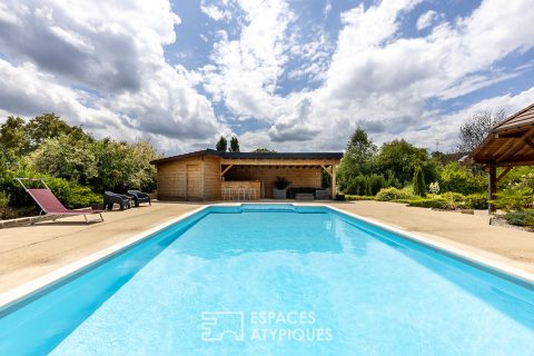 Family home with swimming pool and open views in a peaceful setting