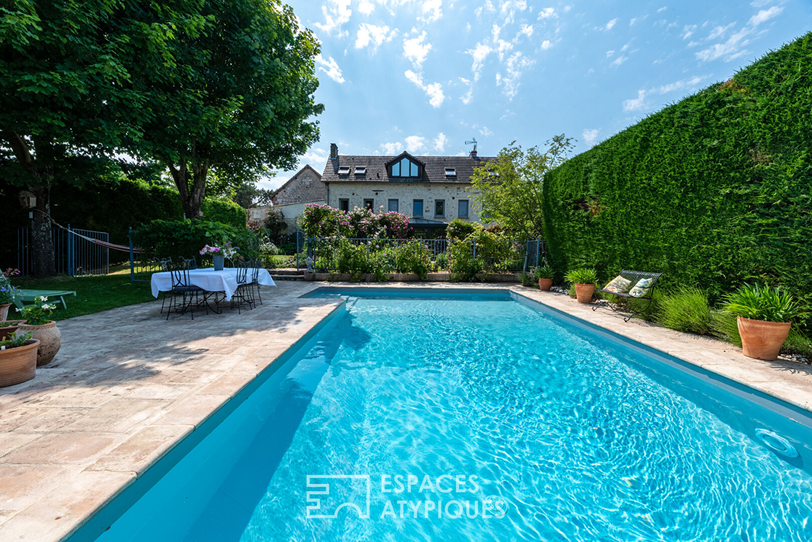 Stone family house with swimming pool and outbuildings